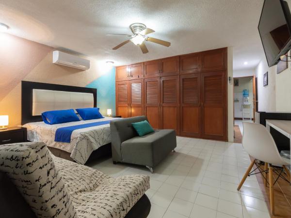 Jardín Mérida : photo 1 de la chambre chambre triple avec balcon