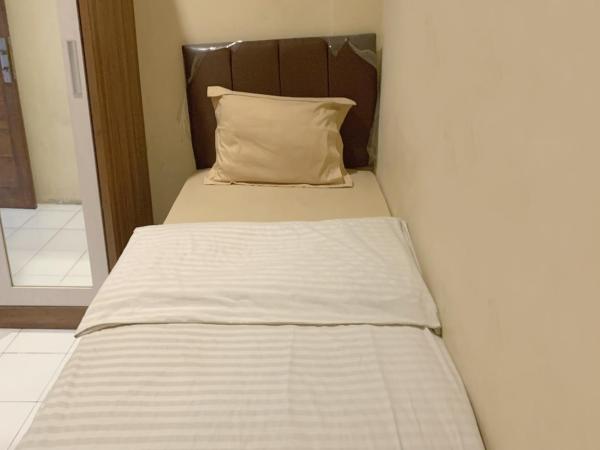 Residence 21 Syariah : photo 1 de la chambre chambre simple