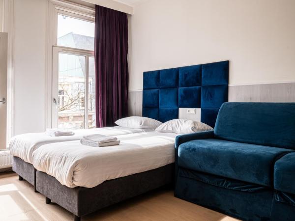 Hotel Kap City Centre : photo 1 de la chambre chambre quadruple standard avec salle de bains privative