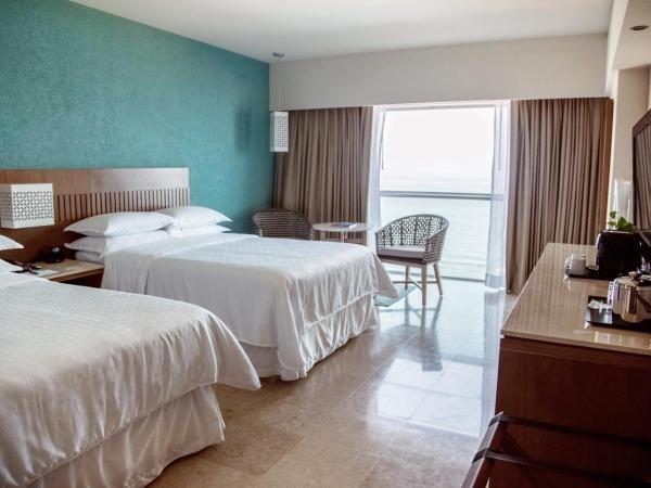 Sheraton Buganvilias Resort & Convention Center : photo 3 de la chambre grande chambre deluxe avec 2 lits doubles - vue sur baie