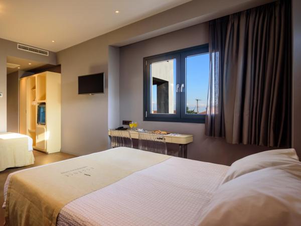 Essence Hotel : photo 1 de la chambre elegant triple room with city view