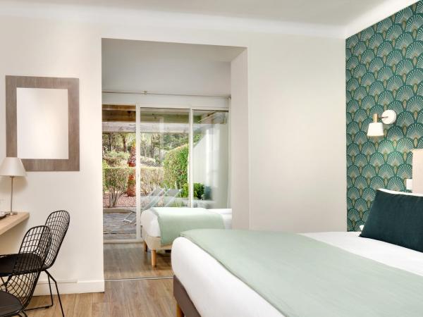 Hôtel & Spa Les Mouettes : photo 1 de la chambre chambre triple - vue sur jardin