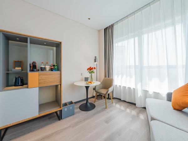 UrCove by HYATT Hangzhou Riverside CBD : photo 1 de la chambre chambre lits jumeaux exécutive