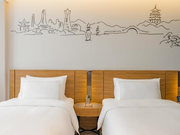 UrCove by HYATT Hangzhou Riverside CBD : photo 2 de la chambre chambre lits jumeaux exécutive