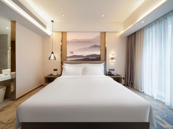 Guangzhou Nansha Meihao Lizhi Hotel : photo 3 de la chambre chambre lit queen-size deluxe