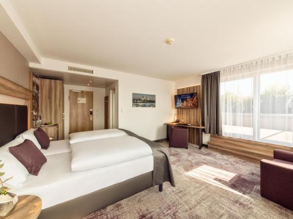 CityClass Hotel am Dom : photo 2 de la chambre suite junior avec terrasse - vue sur cathédrale