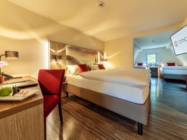 CityClass Hotel am Heumarkt : photo 1 de la chambre chambre familiale