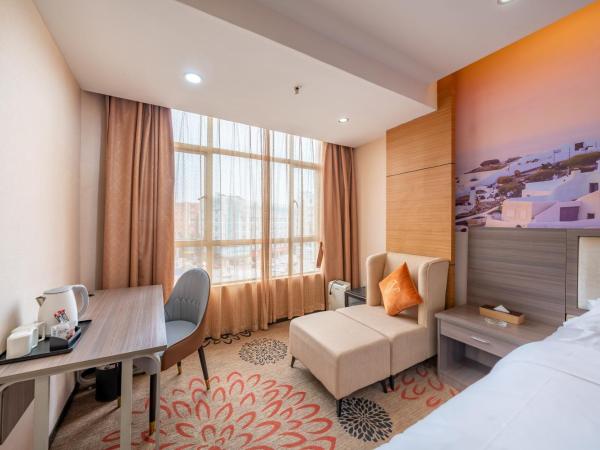 Meicheng Hotel - Guangzhou Huangpu Nangang Times City : photo 2 de la chambre grande chambre lit king-size