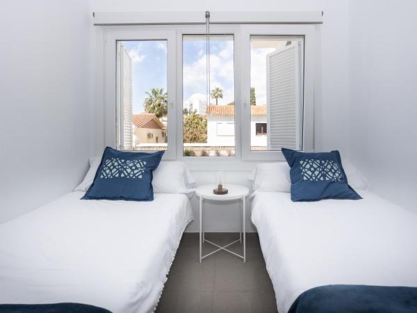 San Miguel 34 Rooms : photo 4 de la chambre chambre lits jumeaux avec salle de bains commune