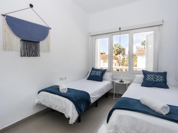 San Miguel 34 Rooms : photo 6 de la chambre chambre lits jumeaux avec salle de bains commune