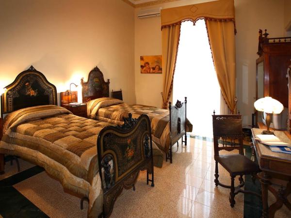 B&B Il Caravaggio : photo 4 de la chambre chambre triple avec salle de bains privative séparée