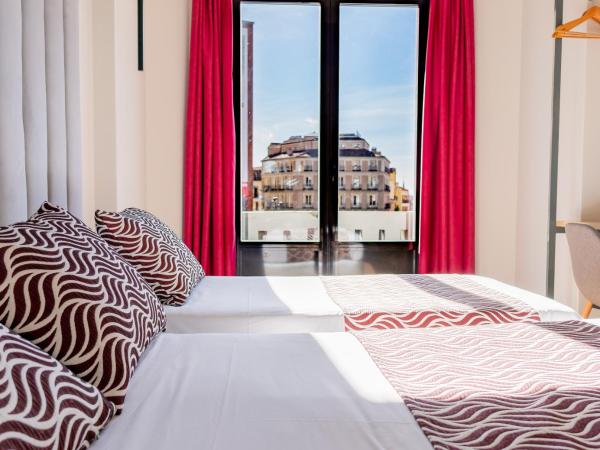 Hostal Juliette-Gran Vía : photo 1 de la chambre chambre triple basique