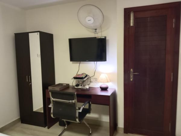 Iris Comfort Inn : photo 4 de la chambre chambre deluxe (2 adultes + 1 enfant)