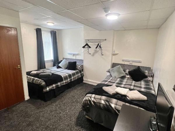 Tudor Rose Hotel : photo 1 de la chambre chambre quadruple