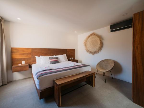 Punta Agave Suites : photo 3 de la chambre suite deluxe avec lit king-size