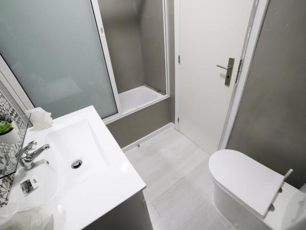 Guest House Triunfo : photo 8 de la chambre chambre familiale (4 adultes)