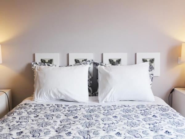 Guest House Triunfo : photo 6 de la chambre chambre familiale (4 adultes)