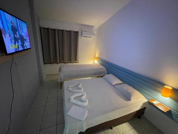 Pousada Encanto dos Mares : photo 2 de la chambre suite