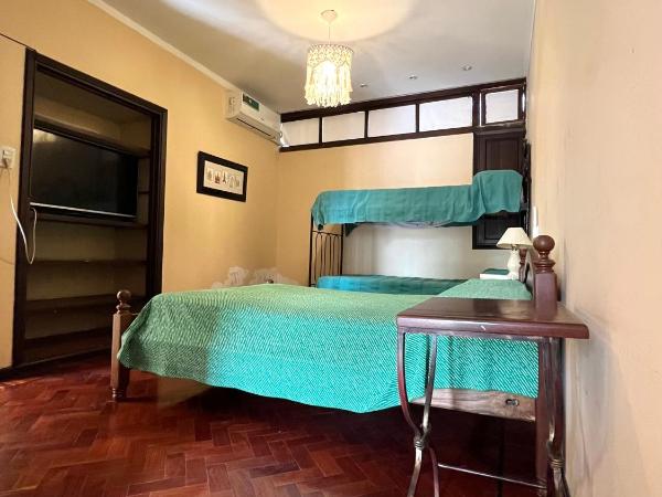 COYA HOSTEL : photo 4 de la chambre chambre quadruple avec salle de bains privative