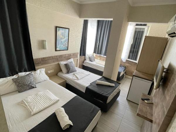 Denizhan Hotel : photo 7 de la chambre chambre quadruple avec salle de bains privative