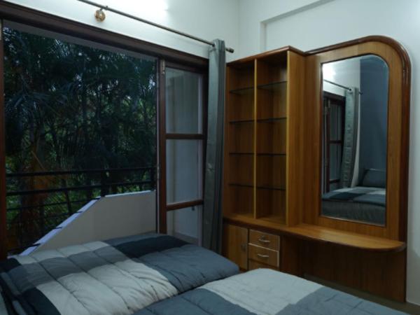 Local NR Green Woods : photo 9 de la chambre chambre double ou lits jumeaux