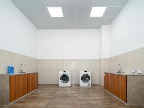 Phoenix Hill Hotel Dongguan - Golf Course Shop : photo 1 de la chambre chambre supérieure lit queen-size