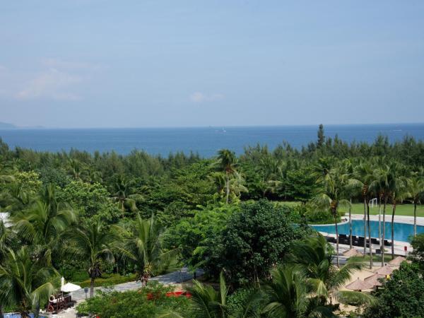 Wanda Realm Resort Sanya Haitang Bay : photo 4 de la chambre chambre lit king-size avec vue frontale sur l'océan