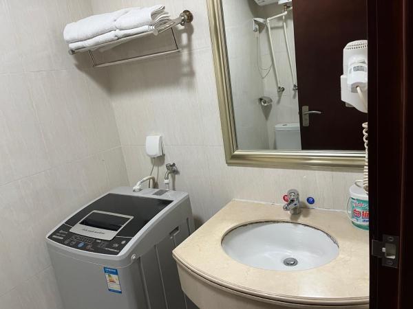 广州朴宿漫享公寓(琶洲国际会展中心店) : photo 10 de la chambre chambre lit queen-size