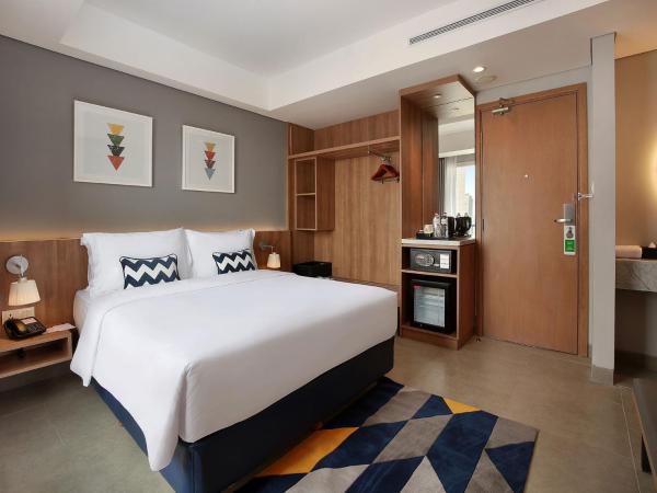 Swiss-Belinn Simatupang : photo 4 de la chambre chambre lit queen-size de luxe