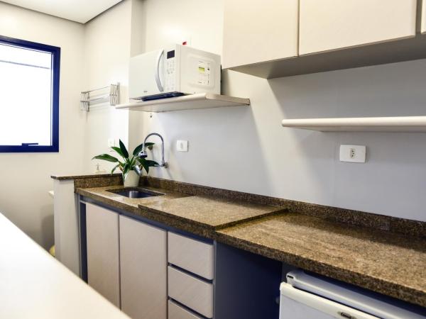 Plaza Inn Small Town Flat : photo 5 de la chambre chambre double deluxe