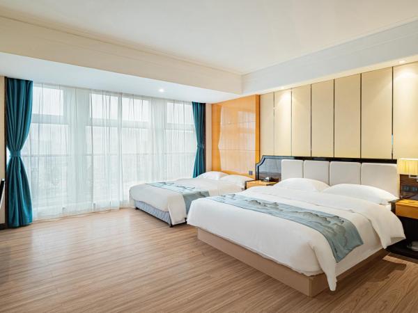 Evening Breeze Hotel 晚风酒店 : photo 1 de la chambre city view family twin room