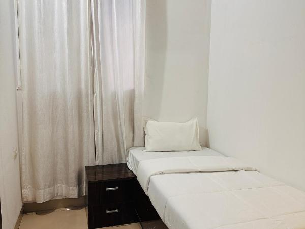 Elite stays viman nagar : photo 2 de la chambre chambre simple avec salle de bains 