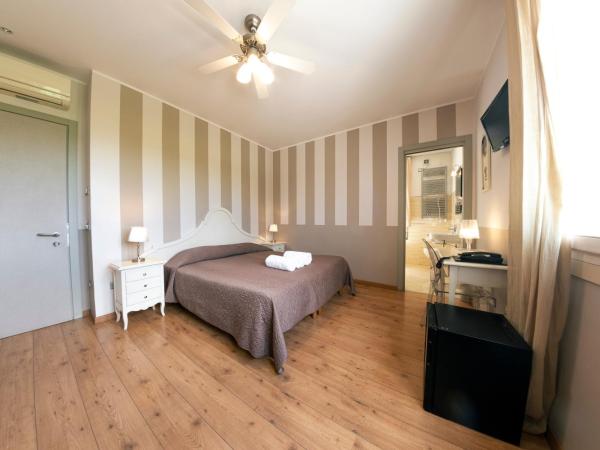 Hotel Volta : photo 5 de la chambre chambre double ou lits jumeaux - vue sur jardin