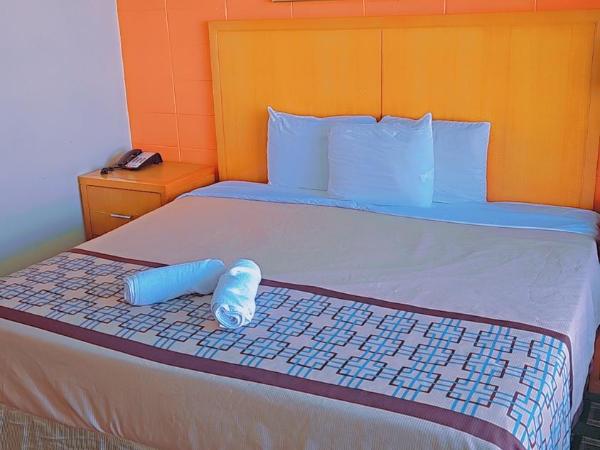 Wayfarer Motel : photo 4 de la chambre hébergement 2 chambres avec 3 lits - 1 lit king-size & 2 lits doubles