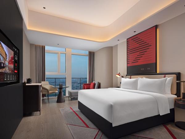 Radisson Red Guangzhou South Railway Station-Canton Fair free shuttle bus & designated license points & Free VPN network : photo 1 de la chambre chambre lit queen-size deluxe