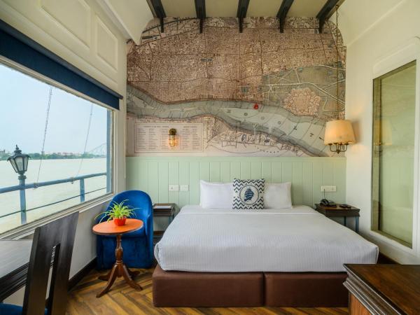 Polo Floatel Kolkata : photo 1 de la chambre suite deluxe avec lit king-size