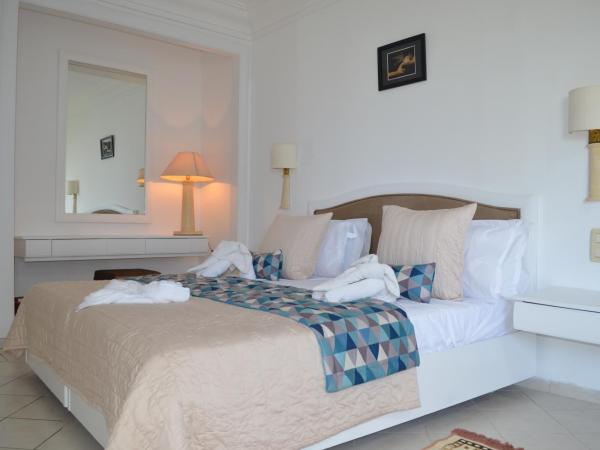 Ruspina Beach Resort : photo 3 de la chambre chambre double ou lits jumeaux - vue sur jardin