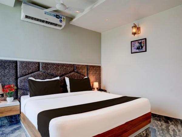 Super Hotel O Om Tapovan : photo 5 de la chambre chambre triple classique