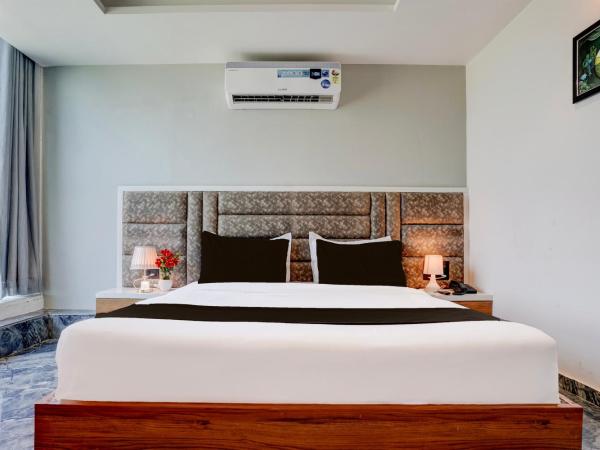 Super Hotel O Om Tapovan : photo 4 de la chambre chambre triple classique