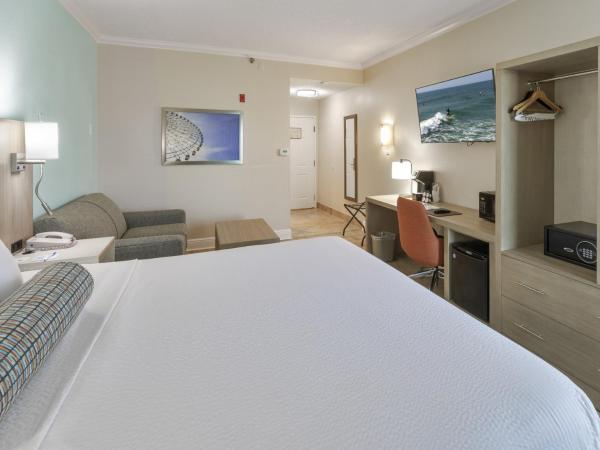 Galleria Palms Orlando - Free Theme Park Shuttles : photo 3 de la chambre chambre lit king-size avec canapé-lit