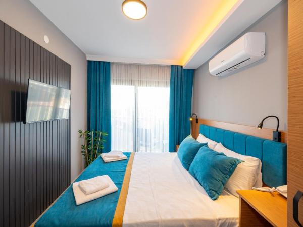 Otel Carpediem Gold Kuşadası : photo 1 de la chambre chambre triple