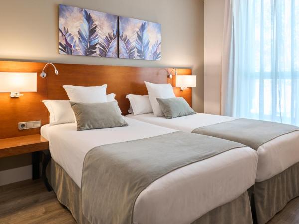 Hotel Puerta de Toledo : photo 1 de la chambre chambre double ou lits jumeaux