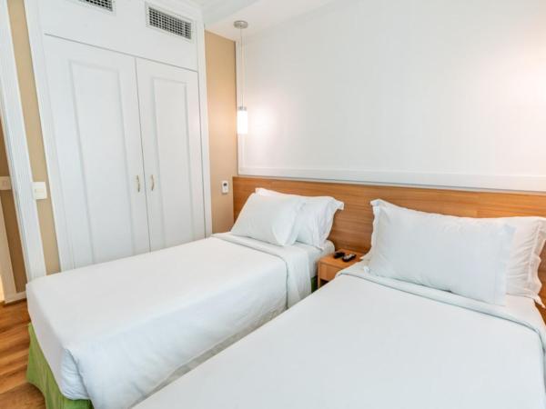 Intercity The Universe Paulista : photo 1 de la chambre standard twin - 2 camas solteiro