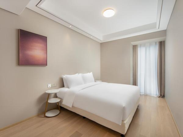 苏州山塘街华贸姑苏里服务公寓 : photo 4 de la chambre suite familiale