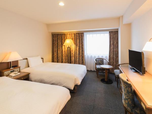 Hotel Sunroute Niigata : photo 1 de la chambre chambre lits jumeaux standard - fumeurs