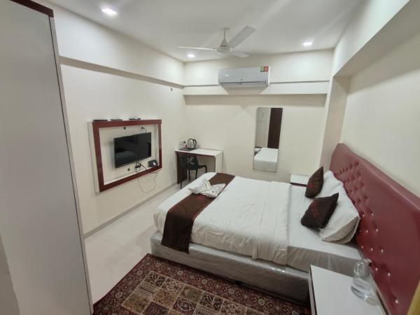 V Check Inn Residence : photo 2 de la chambre chambre standard lit queen-size