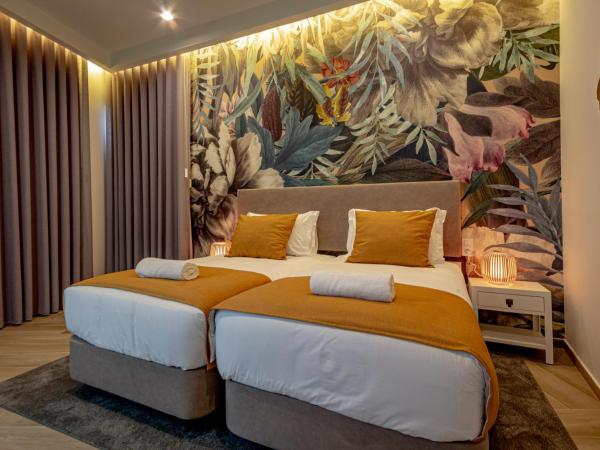 Guest House Jacarandá Faro : photo 7 de la chambre chambre lits jumeaux