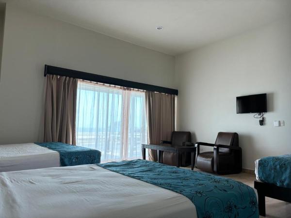 Coral Island Beach View Hotel : photo 5 de la chambre chambre familiale - vue sur mer
