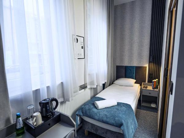 Elegant Apartments : photo 6 de la chambre chambre simple avec salle de bains