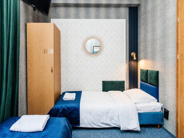 Elegant Apartments : photo 6 de la chambre chambre lits jumeaux avec salle de bains privative